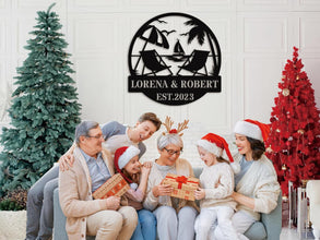 Personalized beach metal sign with chairs, palm trees, and sailboat, custom names and date, laser-cut steel wall art for weddings, anniversaries, or beach house decor.