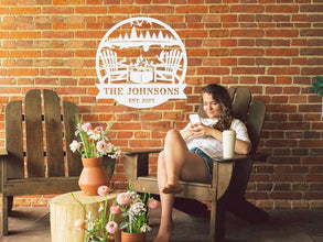 Custom firepit metal sign with family name and established year, laser cut from steel and powder coated, personalized outdoor wall décor with chairs, fire, and nature design.