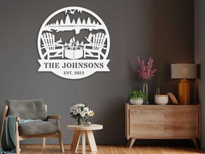 Custom firepit metal sign with family name and established year, laser cut from steel and powder coated, personalized outdoor wall décor with chairs, fire, and nature design.