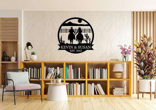Personalized cowboy couple metal wall art featuring two riders holding hands, custom name and date, rustic western decor, laser-cut steel sign for home or gift