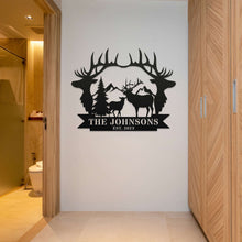 Custom metal sign featuring deer, antlers, pine trees, mountains, and personalized family name and established year.