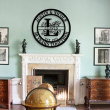 Personalized round metal sign with family name, floral design, and