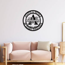 Personalized round metal sign with family name, floral design, and