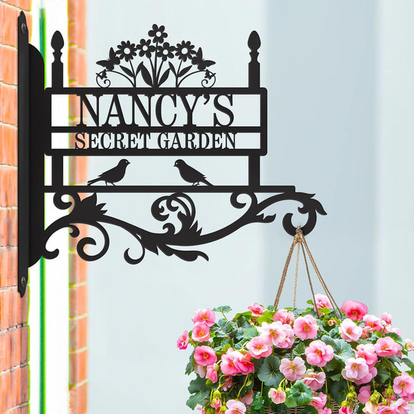 Custom metal garden hook sign with birds and floral design, used for hanging flower basket, personalized with “Nancy’s Secret Garden”