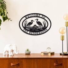 Custom heron metal sign with personalized text, laser-cut steel wall décor for cottage, lake house, or cabin, powder-coated for outdoor durability.