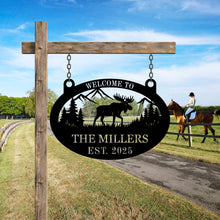 Custom moose metal sign with personalized text, laser-cut steel wall art featuring moose, mountains, and trees, powder coated finish for rustic cabin and lodge décor.