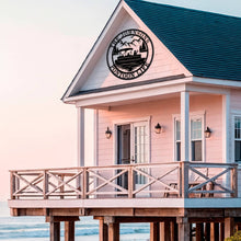 Custom laser-cut metal sign with pontoon boat and personalized family name, ideal for lake house or cabin wall decor