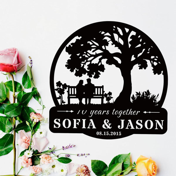 Custom tree metal sign with couple silhouette and personalized text, laser cut from steel and powder coated, ideal for wedding, anniversary, or family wall décor.