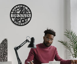 Round custom laser-cut metal sign with gear design and personalized name for workshop or garage wall decor