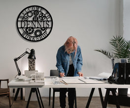 Round custom laser-cut metal sign with gear design and personalized name for workshop or garage wall decor