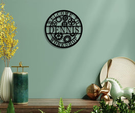 Round custom laser-cut metal sign with gear design and personalized name for workshop or garage wall decor