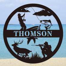 Custom round black metal hunting and fishing sign featuring a fisherman, deer, hunter silhouette, and personalized family name – laser-cut from powder-coated steel for outdoor wall decor.