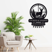 Custom metal deer hunter wall sign featuring buck in scope with bullet detail, powder-coated black steel, perfect for hunting cabin or man cave décor with customizable text.