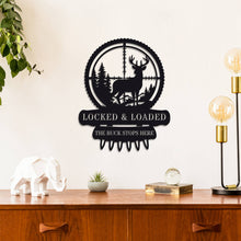 Custom metal deer hunter wall sign featuring buck in scope with bullet detail, powder-coated black steel, perfect for hunting cabin or man cave décor with customizable text.