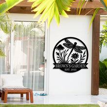 Custom round metal garden sign with dragonfly and flower design, featuring the text 'Brown's Garden Est. 2025'