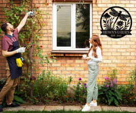 Custom round metal garden sign with dragonfly and flower design, featuring the text 'Brown's Garden Est. 2025'