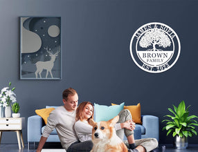 Custom metal family tree sign with names and date laser-cut into black powder-coated steel for personalized home décor.