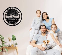 Custom metal family tree sign with names and date laser-cut into black powder-coated steel for personalized home décor.