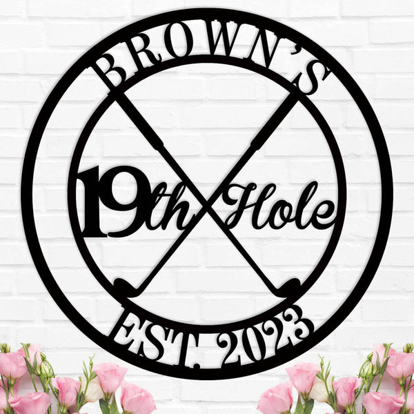 Round custom metal golf sign featuring crossed golf clubs and "19th Hole" text, personalized with name and established year, made from durable powder-coated steel.