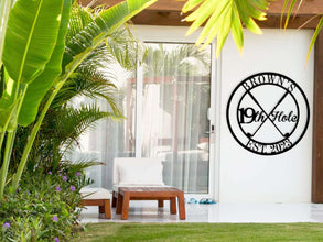 Round custom metal golf sign featuring crossed golf clubs and