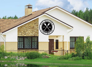 Custom lake house metal sign with crossed oars, personalized name, location, and year, laser-cut from steel and powder coated for outdoor durability