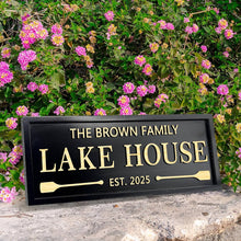 Custom engraved pine wood sign with personalized text, paddle design, and weatherproof finish – perfect for lake house or rustic cabin decor