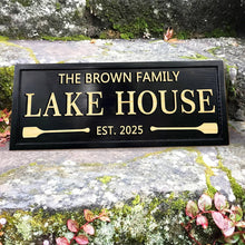 Custom engraved pine wood sign with personalized text, paddle design, and weatherproof finish – perfect for lake house or rustic cabin decor