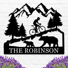 Custom bicycle metal sign with mountain and bear design, personalized family name cycling wall art, laser cut steel décor for rustic home or outdoor cabin.