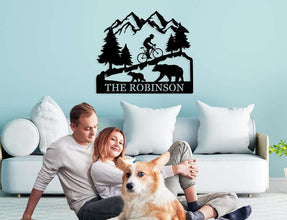 Custom bicycle metal sign with mountain and bear design, personalized family name cycling wall art, laser cut steel décor for rustic home or outdoor cabin.