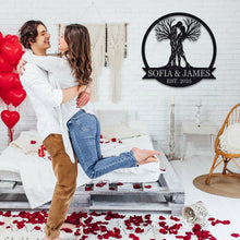 Custom Tree Couple Metal Sign featuring intertwined lovers as tree trunks, personalized with names and date, laser-cut from premium steel with powder-coated finish.