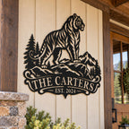Personalized tiger mountain metal sign displayed on the exterior wall of a rustic mountain lodge.