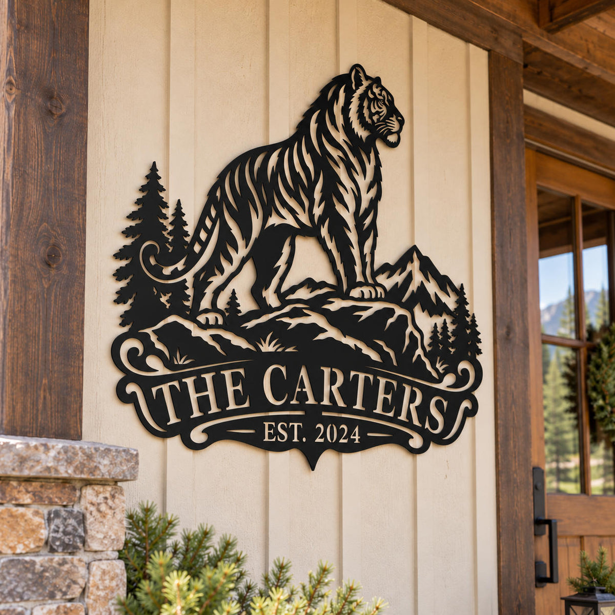 Personalized tiger mountain metal sign displayed on the exterior wall of a rustic mountain lodge.