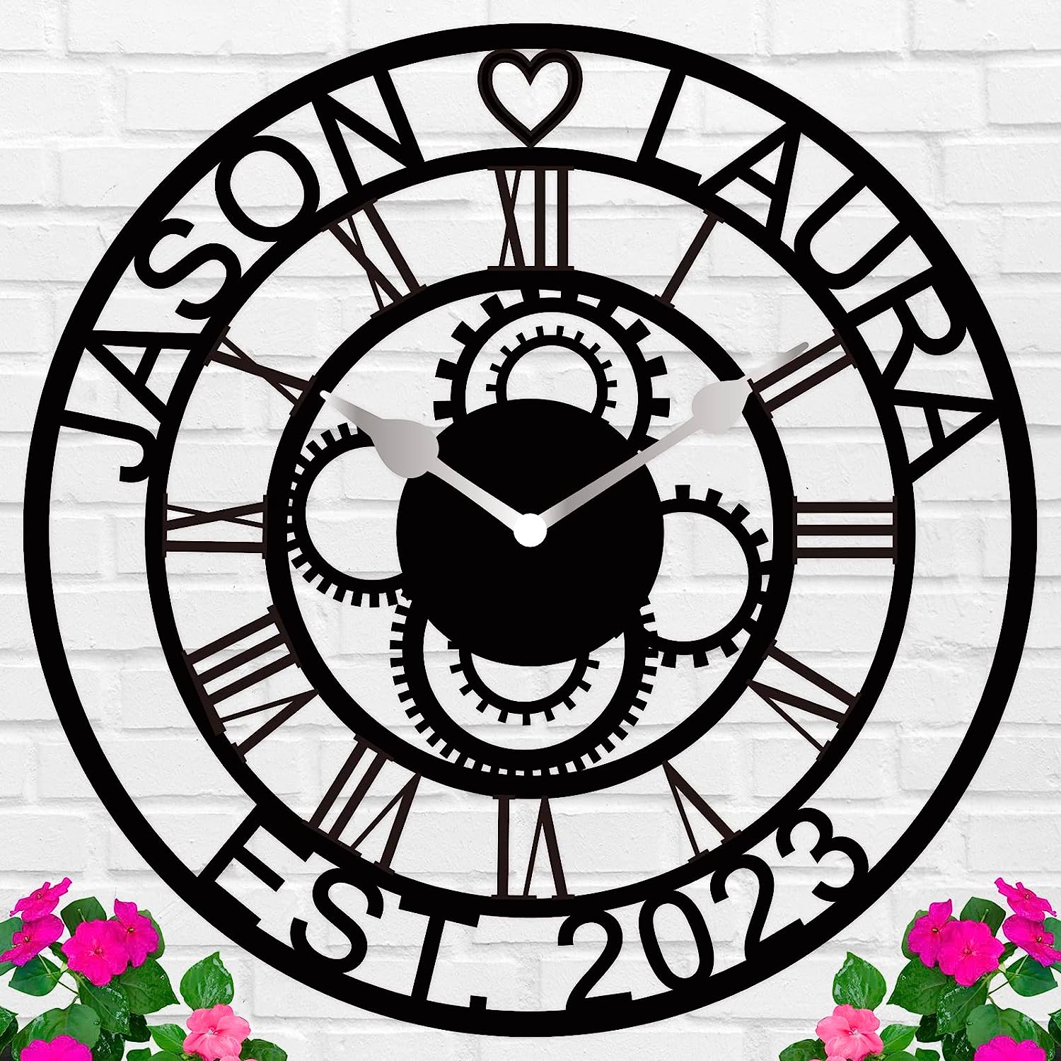 Large personalized black metal wall clock with laser-cut cutout gears, couple names Jason and Laura, center heart icon, established 2023, and Roman numerals. Main image