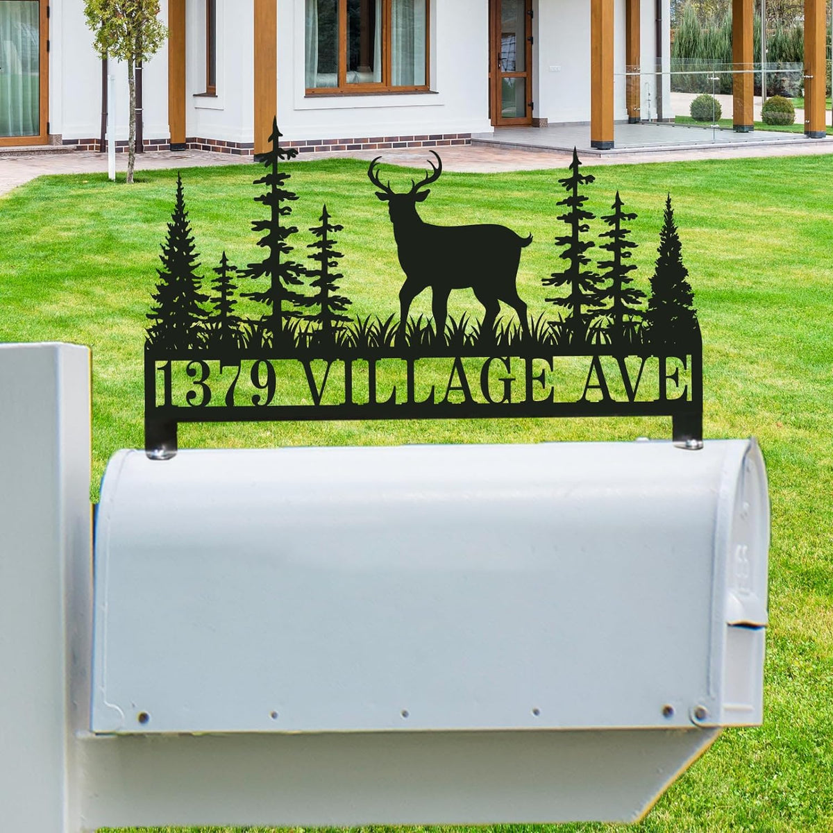 Customized stainless steel mailbox topper with a majestic deer and pine trees silhouette, black powder-coated finish with personalized house address text. Main image