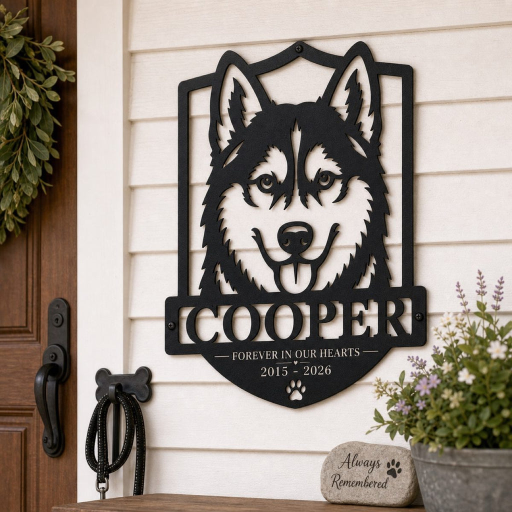 Custom Husky Pet Memorial Metal Sign displayed on a backyard garden fence with flowers, memorial stones, and visible mounting screws.