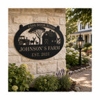 Custom farm metal sign mounted on a stone exterior wall.