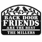 Black Back Door Friends Are the Best metal sign with two birds, leafy branches, and The Millers family name on a white background.