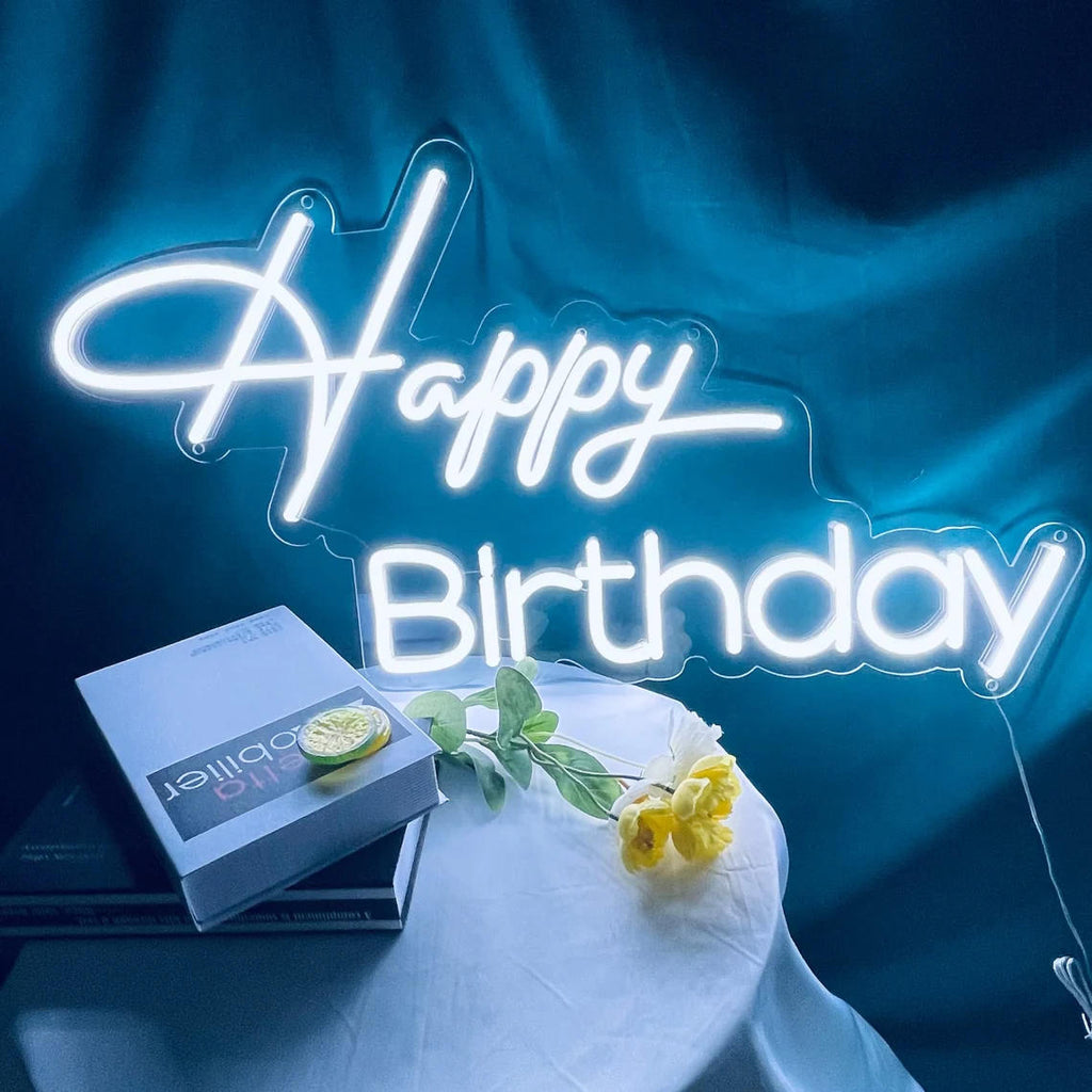 Happy Birthday neon sign glowing in white LED light for birthday party backdrop and celebration decor