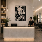 Black abstract iron wall art installed in a modern salon reception area with elegant interior design