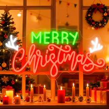 Merry Christmas neon sign in red and green LED lights mounted on brick wall for holiday decoration