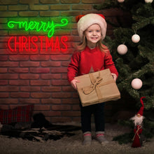 Merry Christmas neon sign in red and green LED lights mounted on brick wall for holiday decoration