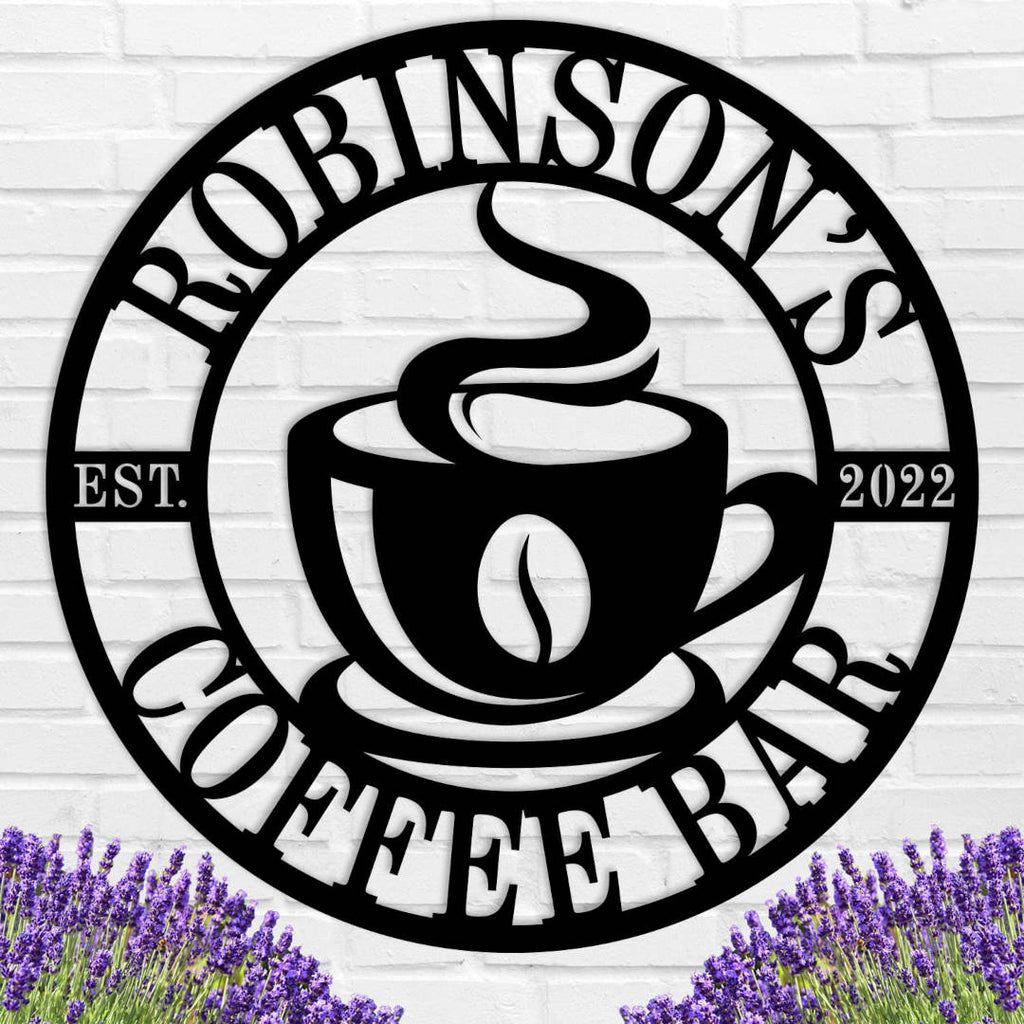Custom coffee bar metal sign featuring a steaming cup and personalized name text, laser-cut from premium steel with powder-coated black finish.