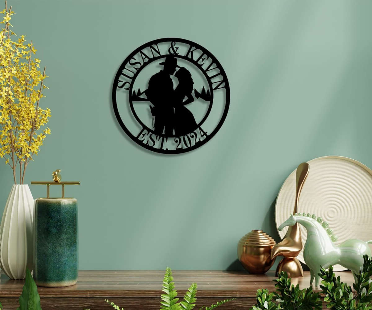 Personalized couple silhouette metal sign with custom names and established year in a circular steel design, perfect for wedding and anniversary home décor.