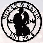 Personalized couple silhouette metal sign with custom names and established year in a circular steel design, perfect for wedding and anniversary home décor.