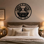 50th wedding anniversary metal sign with hummingbirds mounted above a bed in a romantic bedroom.