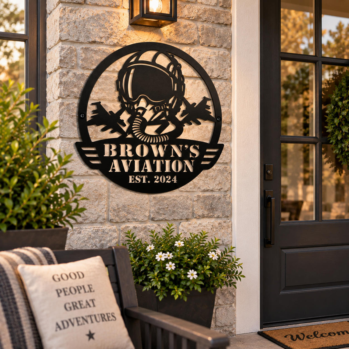 Personalized Brown’s Aviation metal sign displayed on an exterior wall beside a modern home entrance.