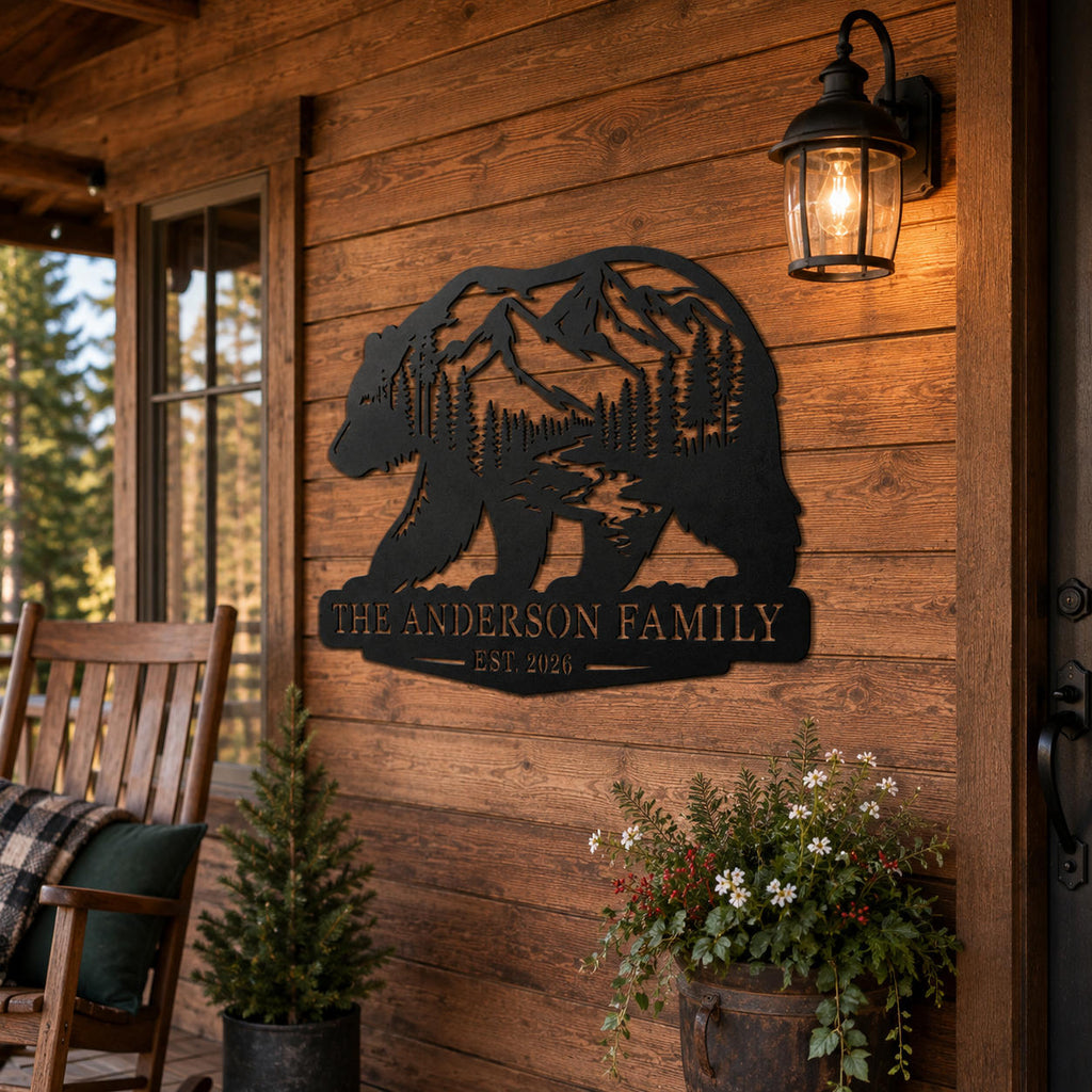 Custom bear mountain family metal sign mounted on a rustic wood cabin porch wall.
