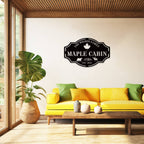 Custom metal cabin sign featuring bear, moose, maple leaf and personalized family name, laser-cut from powder-coated steel
