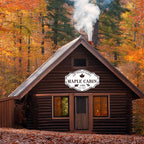Custom metal cabin sign featuring bear, moose, maple leaf and personalized family name, laser-cut from powder-coated steel