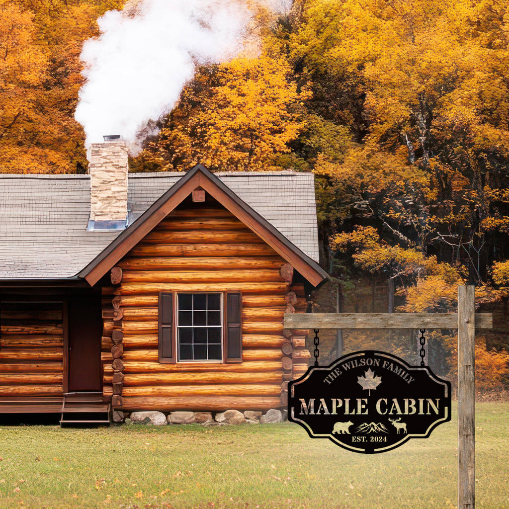 Custom metal cabin sign featuring bear, moose, maple leaf and personalized family name, laser-cut from powder-coated steel
